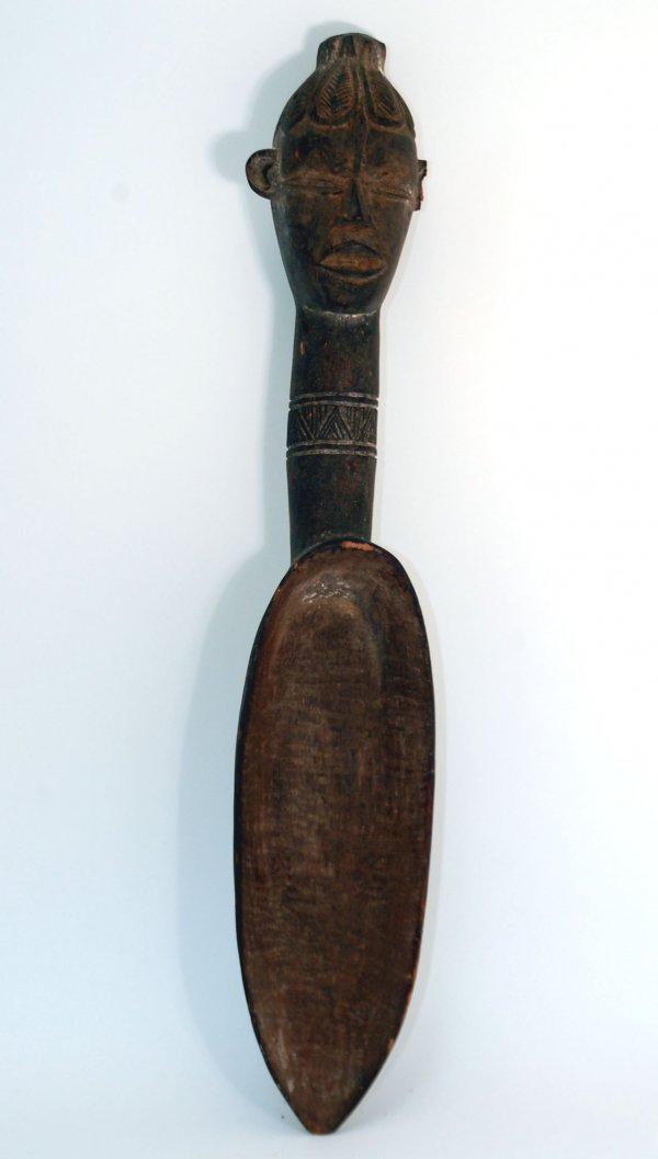 Appraisal: Dan carved wooden ceremonial rice spoon with a decorative bust