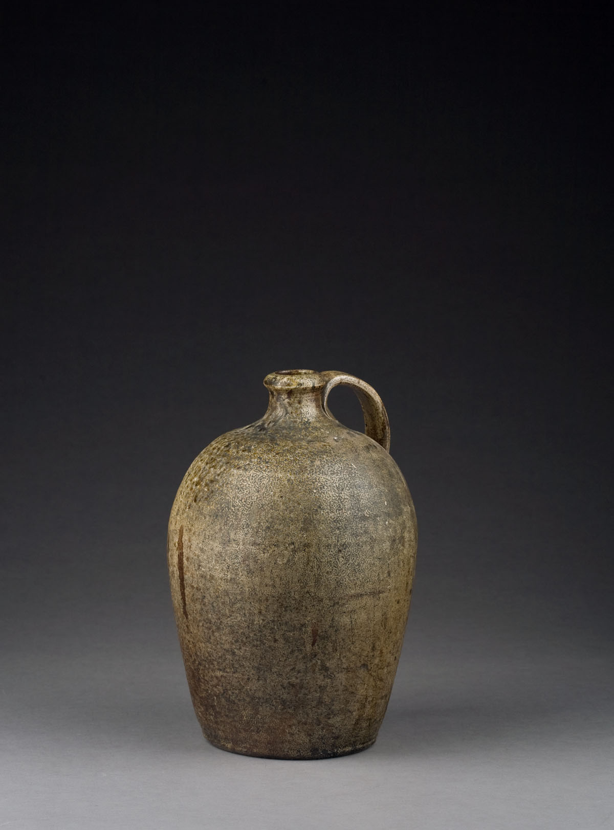 Appraisal: AMERICAN SALTGLAZE STONEWARE JUG EARLY NINETEENTH CENTURY Of bulbous tapering