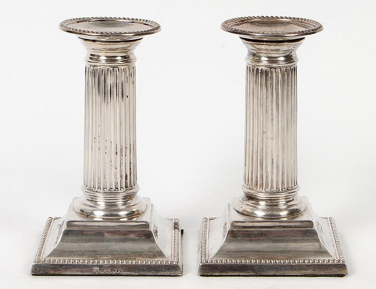 Appraisal: PAIR OF EDWARDIAN REEDED SILVER CANDLESTICKSEnglish Circa Marked With short