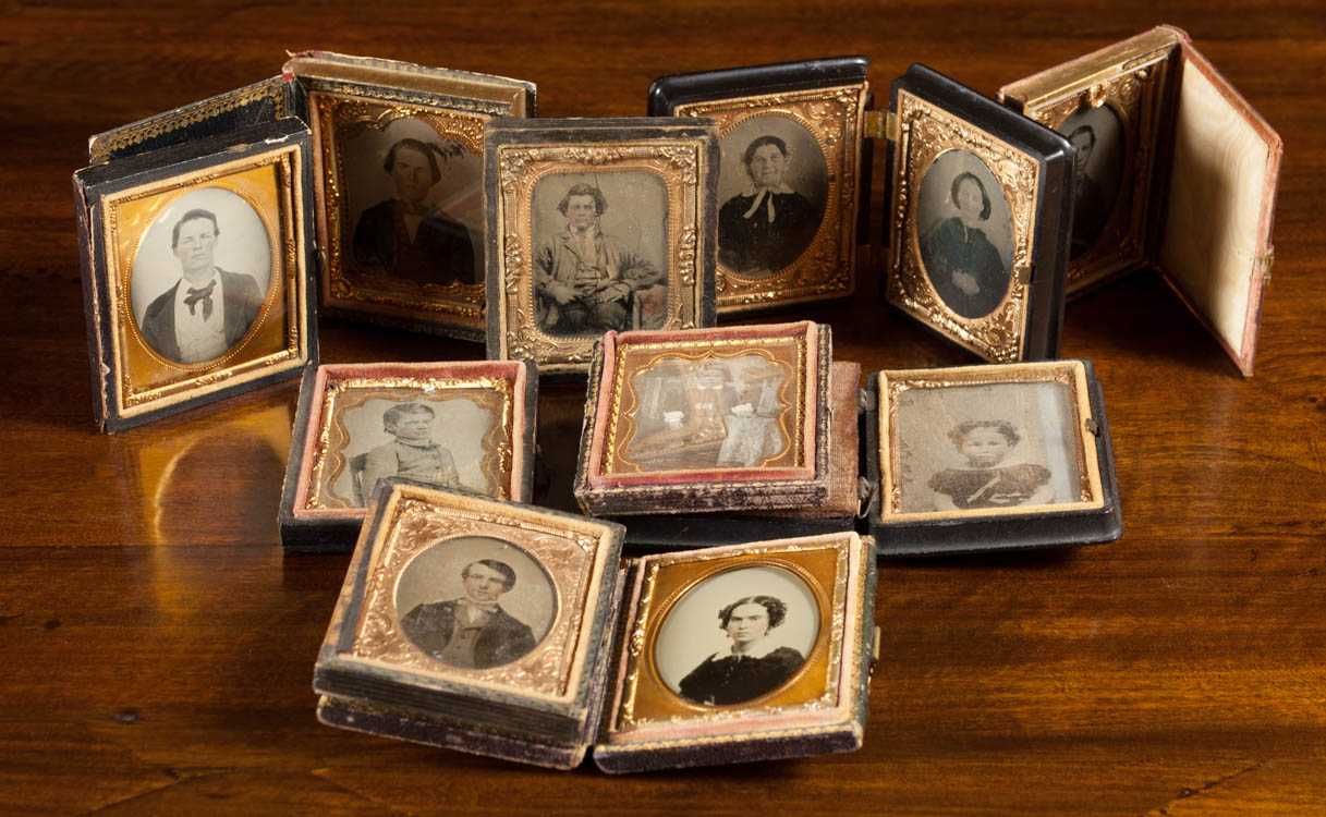 Appraisal: ELEVEN ANTIQUE PHOTOS stored in cases Two are daguerreotype three