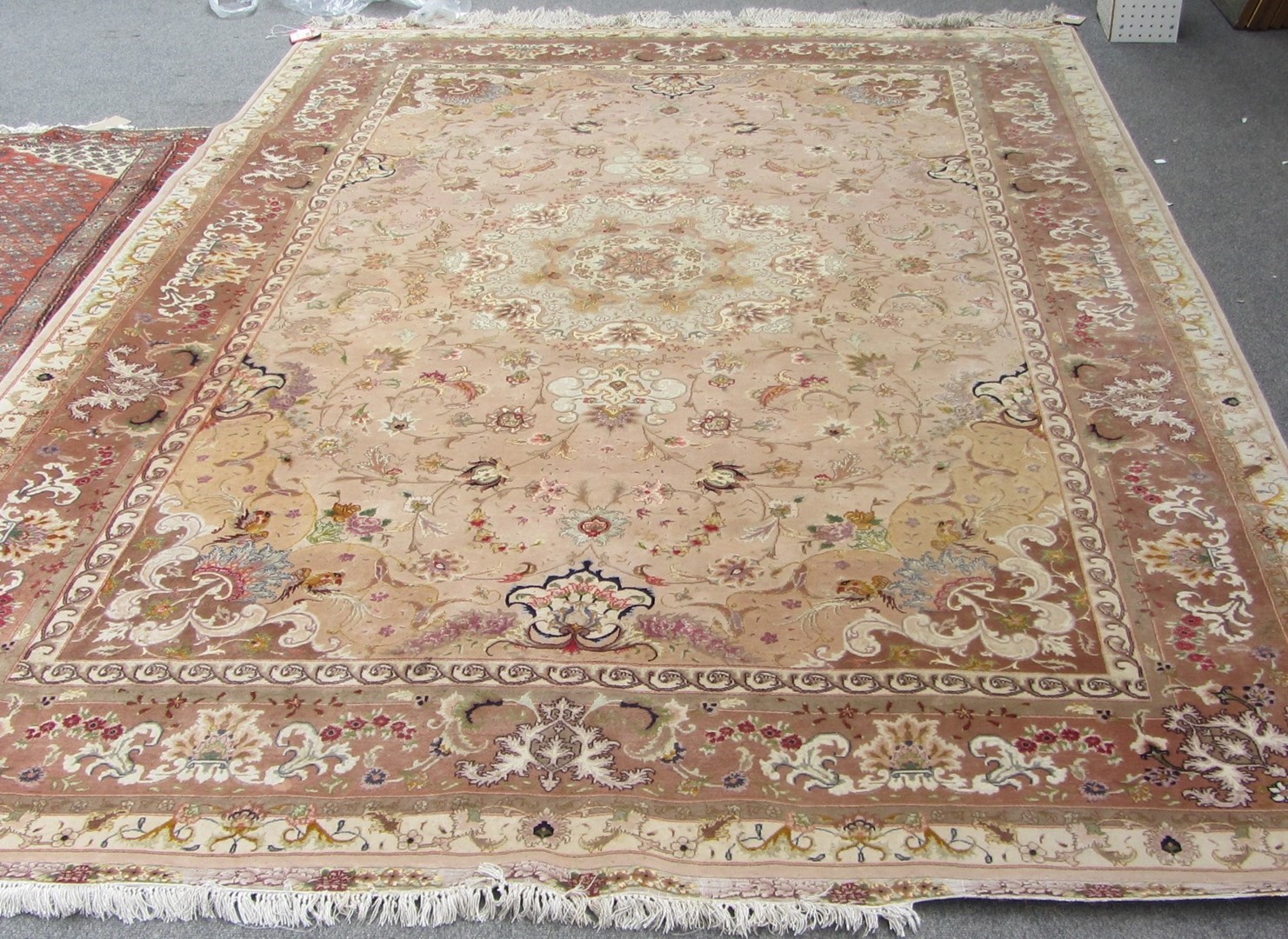 Appraisal: A part silk Tabriz carpet Persian the beige field with