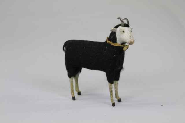 Appraisal: RAM ORNAMENT Large black woolly ram with tin horns brass