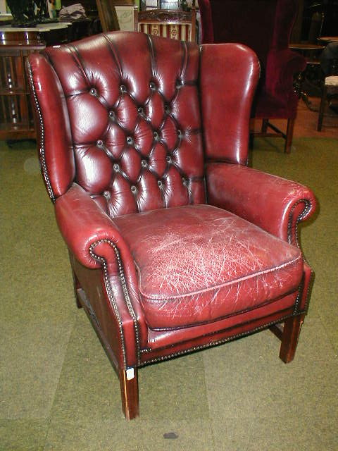 Appraisal: A Georgian style red leather upholstered library chair