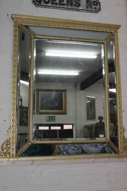 Appraisal: A LARGE OLD CUSHION FRAMED OVERMANTLE MIRROR with bevelled mirror