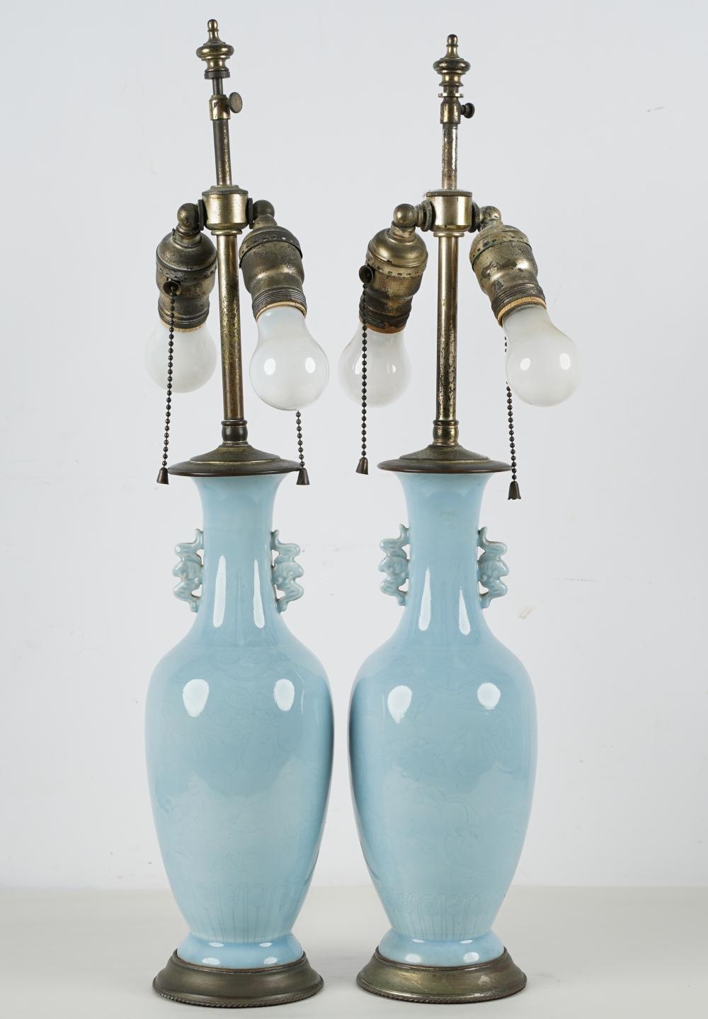 Appraisal: PAIR OF CHINESE PALE BLUE PORCELAIN VASESCondition mounted and electrified