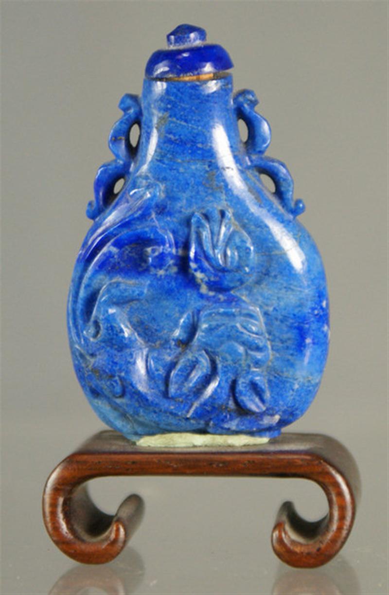 Appraisal: carved lapis lazuli snuff bottle dragon seeking flaming pearl design