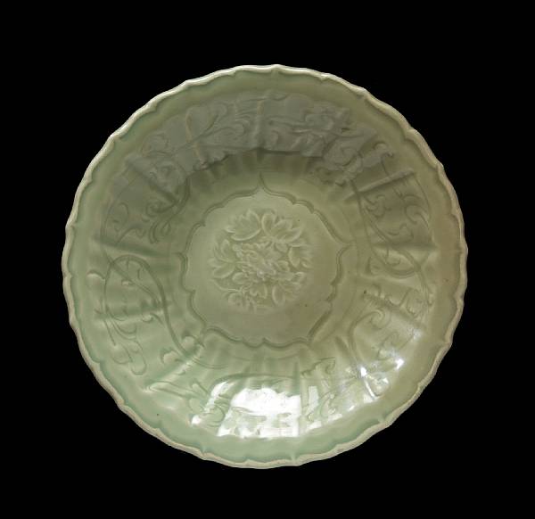 Appraisal: A Longquan celadon dish Ming Dynasty Thickly molded with a