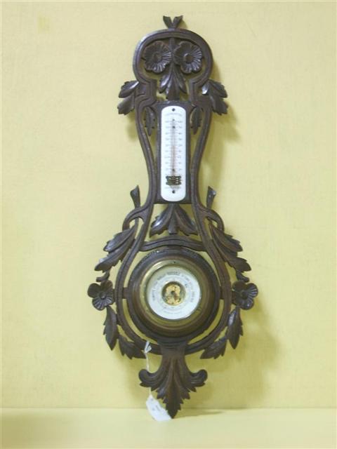 Appraisal: WATERBURY BLACK FOREST STYLE THERMOMETER BAROMETER Carved with flowers and