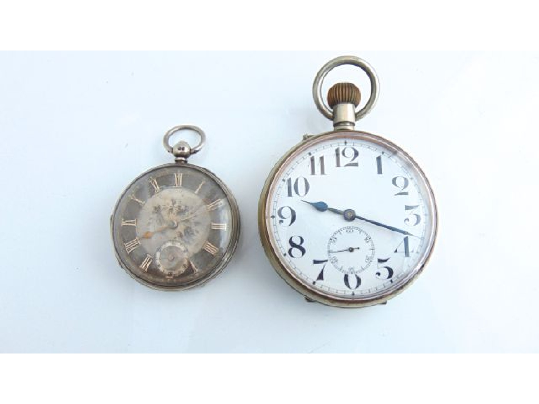 Appraisal: A Goliath pocket watch the white enamelled dial with black