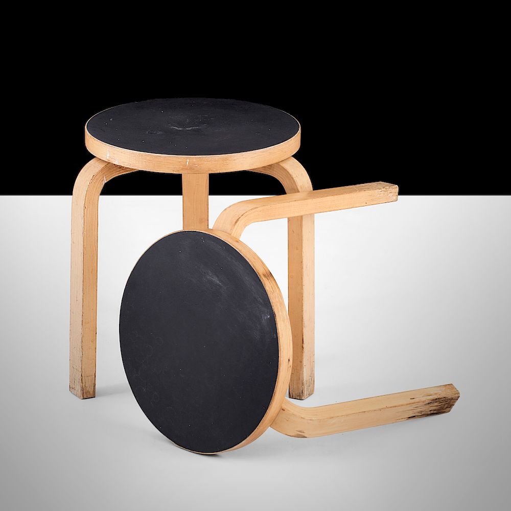 Appraisal: Alvar Aalto A pair of tree-legged stools model designed by