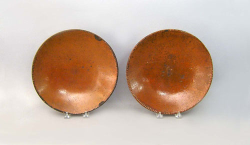 Appraisal: Two redware plates th c dia