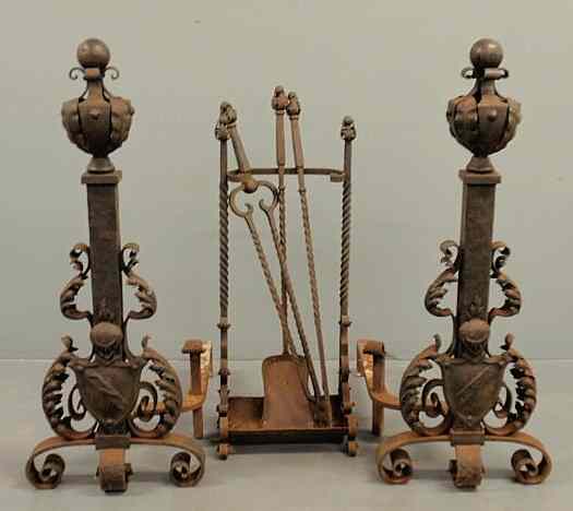 Appraisal: Massive pair of medieval style wrought iron andirons and fireplace