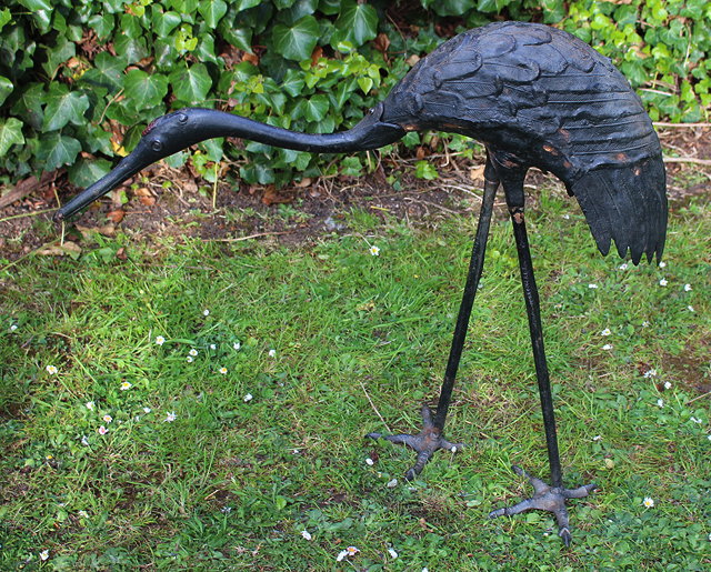 Appraisal: A CAST BRONZED SCULPTURE OF A STANDING CRANE cm high