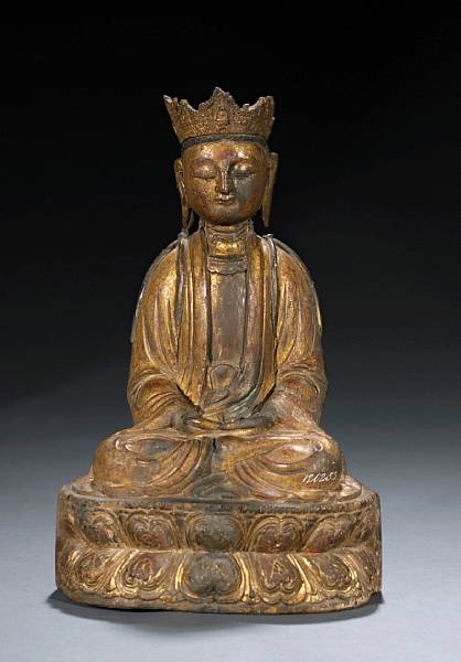 Appraisal: A gilt and polychrome painted wood seated Buddhist figure Ming