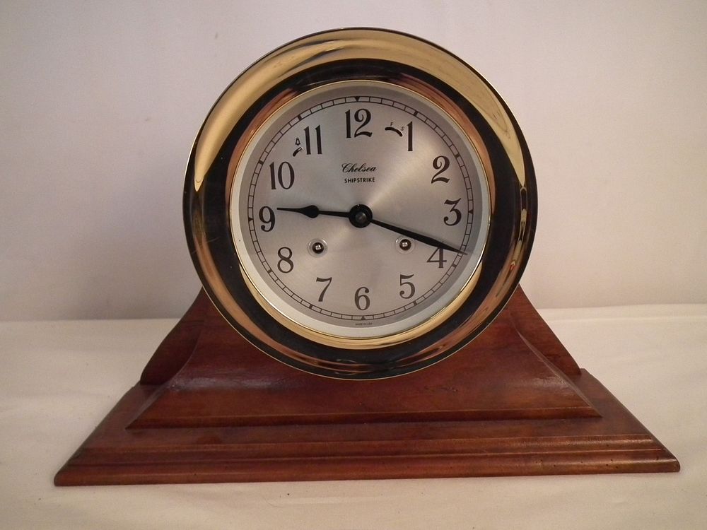 Appraisal: CHELSEA SHIPSTRIKE CLOCK Modern Chelsea Shipstrike clock on mahogany stand