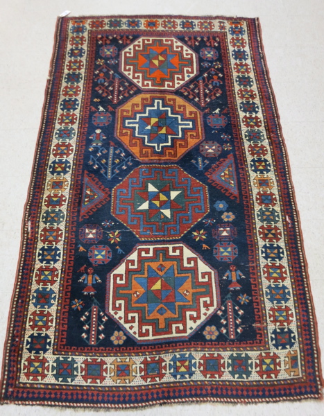 Appraisal: PERSIAN SHIRVAN CARPET Caucasian Kazak influence featuring a red field