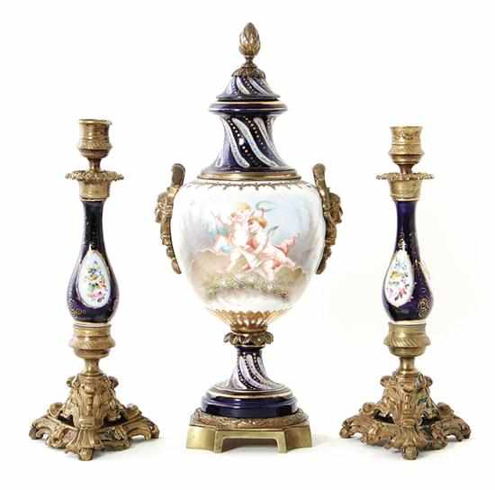 Appraisal: French porcelain covered urn and pair of candlesticks late th