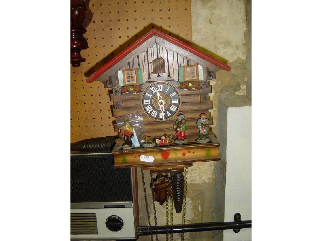 Appraisal: A small timber cuckoo clock in the form of a