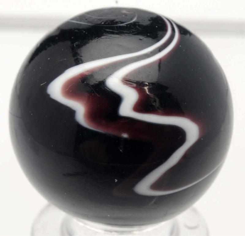 Appraisal: Chevron Style Lightning Bolt Marble Dark opaque purple with white