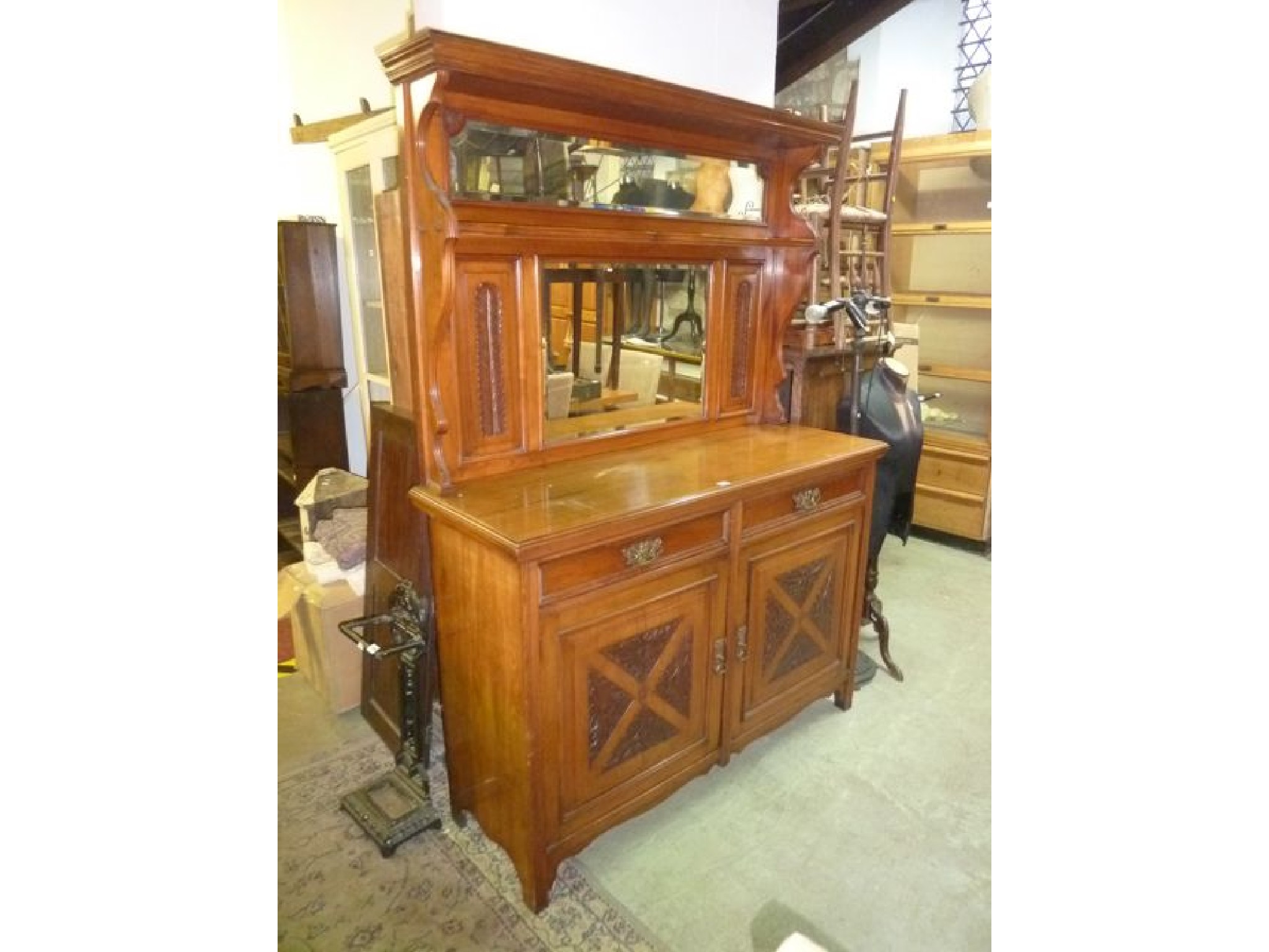 Appraisal: A late Victorian Edwardian walnut sideboard the raised back with