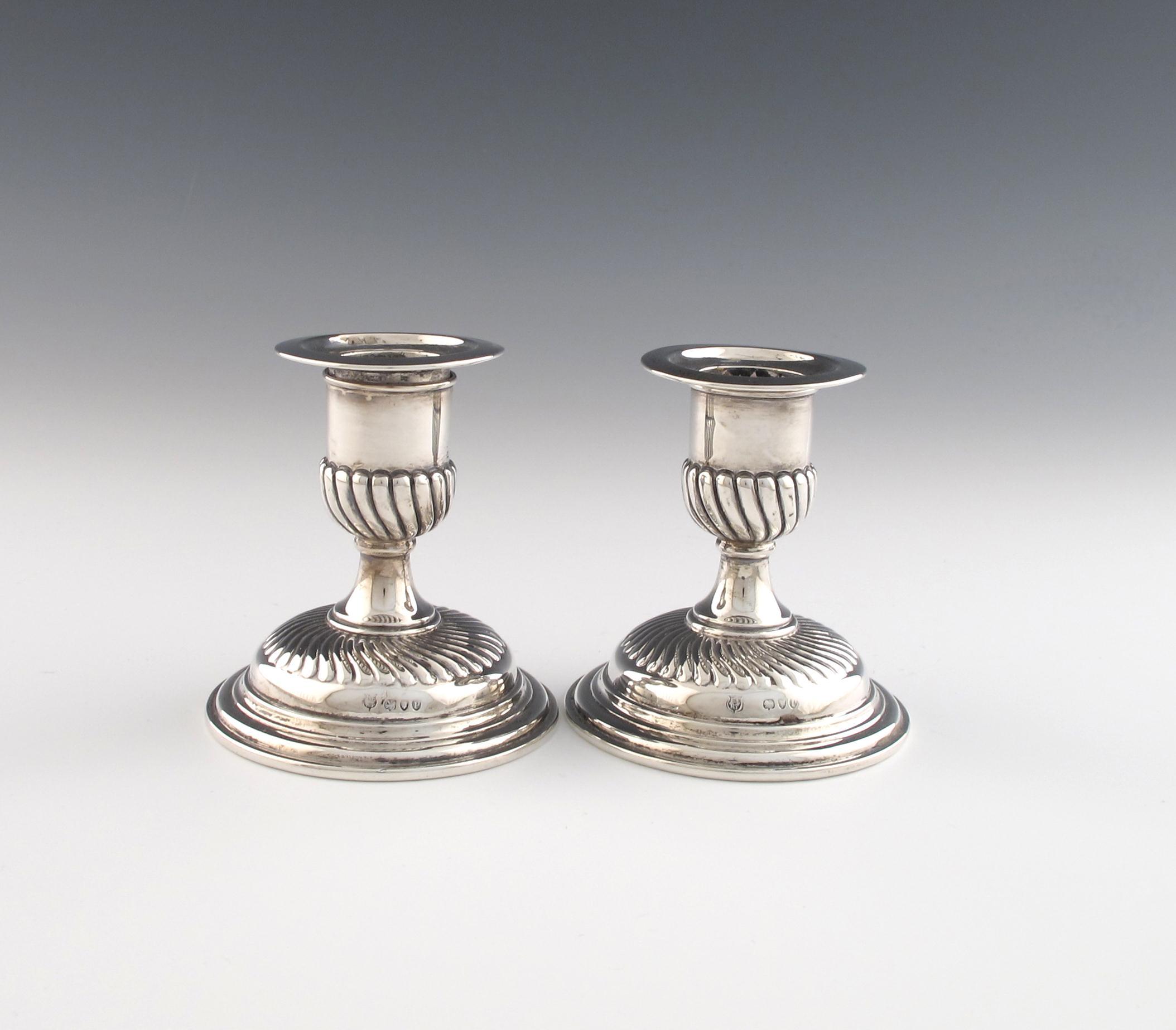 Appraisal: A pair of Victorian silver candlesticks