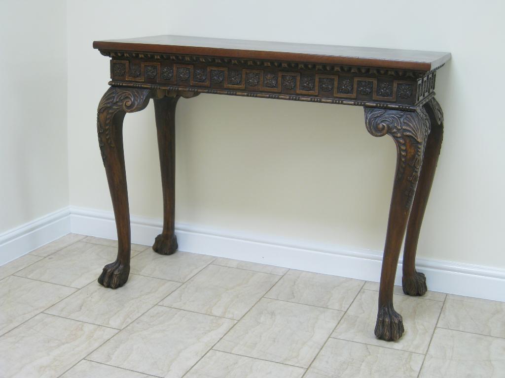 Appraisal: Pair of Georgian style mahogany Serving Tables with carved friezes