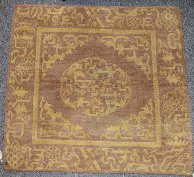 Appraisal: A CHINESE SMALL ANTIQUE SQUARE RUG with archaic symbols x