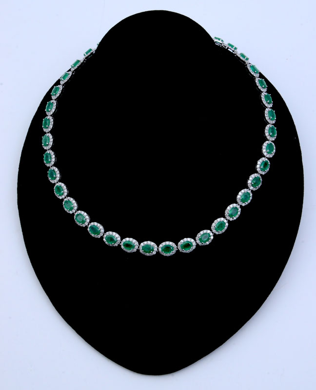 Appraisal: K CTW EMERALD AND DIAMOND NECKLACE prong set mixed oval