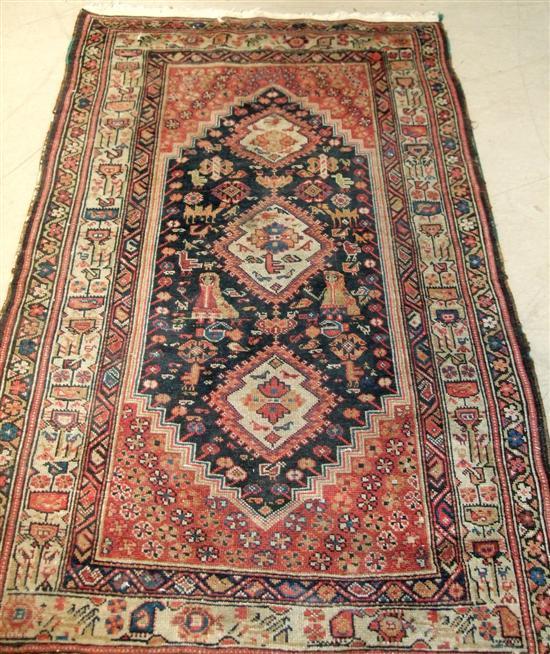 Appraisal: Two Persian rugs the first with an ivory ground repeating