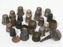 Appraisal: Sewing Interest A collection of unusual metal thimbles including commemoratives