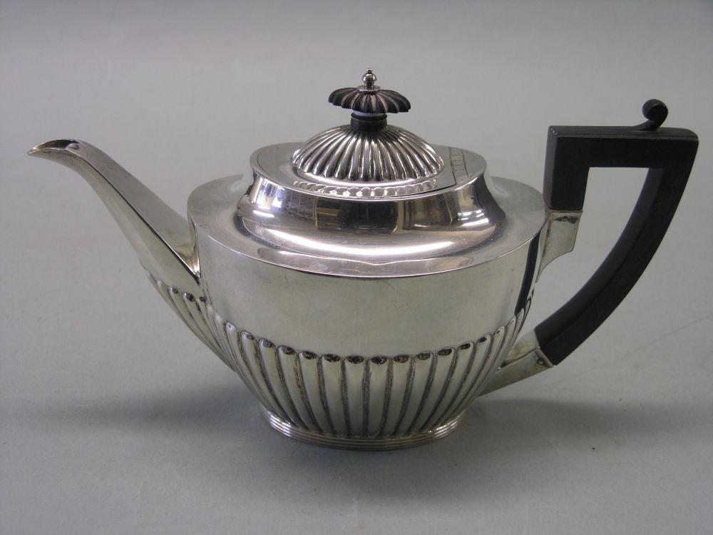 Appraisal: An Edward VII silver bachelor's teapot half-reeded form with ebony