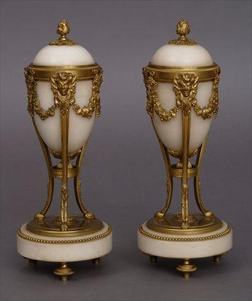 Appraisal: PAIR OF LOUIS XVI-STYLE GILT-BRONZE MOUNTED CASSOLETTES Each ovoid bowl