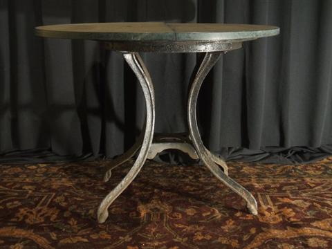 Appraisal: WROUGHT IRON AND SLATE GARDEN TABLE The circular slate top