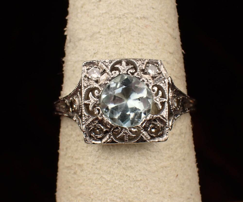 Appraisal: AQUAMARINE DIAMOND AND PLATINUM RING with four round-cut diamonds together