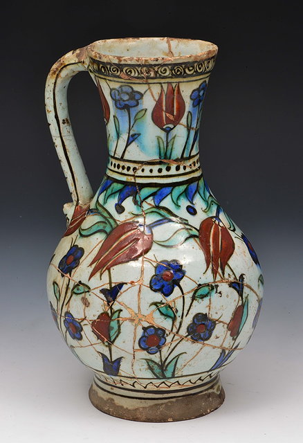 Appraisal: An Iznik jugcirca - decorated with tulips and open flowerheads