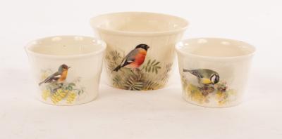 Appraisal: Three Royal Worcester souffl pots painted a great tit chaffinch