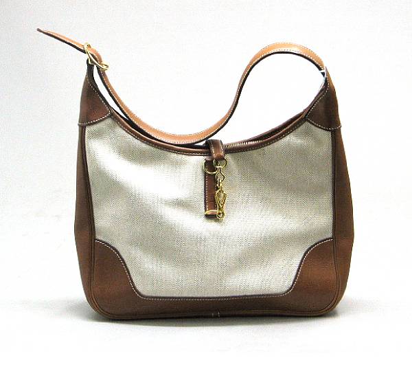 Appraisal: A Hermes leather and canvas shoulder bag Height at center