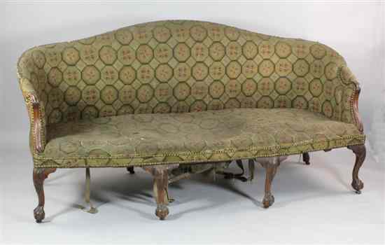 Appraisal: A George III mahogany serpentine settee with scroll arms on