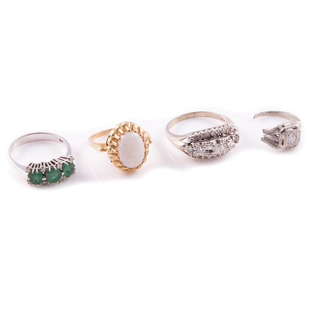 Appraisal: Four gem-set rings including an opal and k gold ring