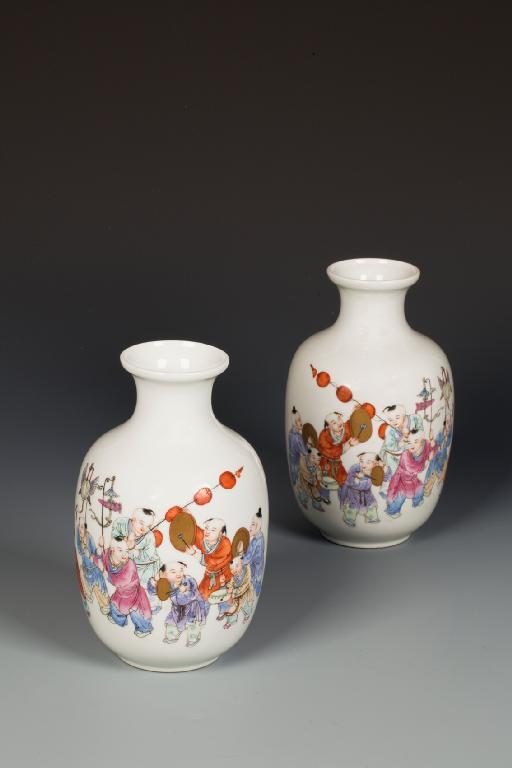 Appraisal: A PAIR OF CHINESE BOYS VASES enamelled in polychrome and