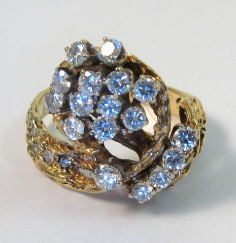 Appraisal: DIAMOND AND FOURTEEN KARAT GOLD RING set with round-cut diamonds