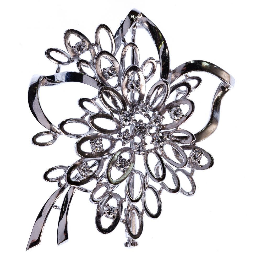 Appraisal: K WHITE GOLD AND DIAMOND BROOCHOpen floral and ribbon setting