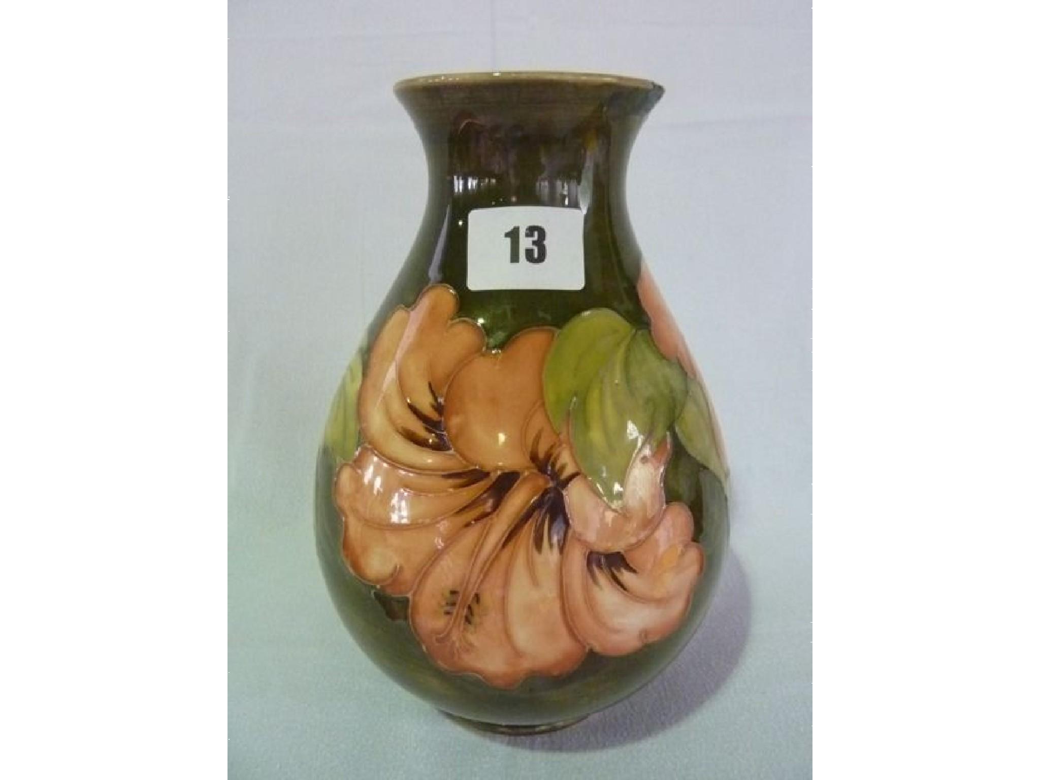 Appraisal: A Moorcroft vase with tube line decoration of coral hibiscus