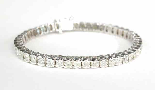 Appraisal: DIAMOND AND FOURTEEN KARAT WHITE GOLD BRACELET - inches in