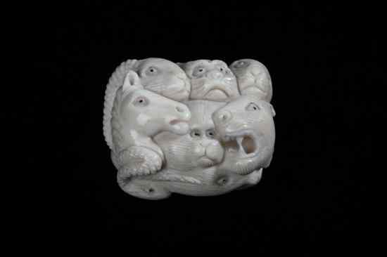 Appraisal: JAPANESE CARVED IVORY NETSUKE OF ANIMAL - in long