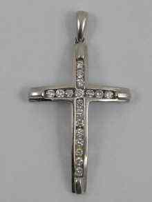 Appraisal: A hallmarked ct white gold diamond set cross pendant