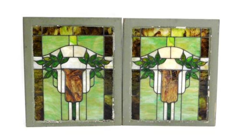 Appraisal: Pair of stained-glass windows decorated with stylized leaves in shades