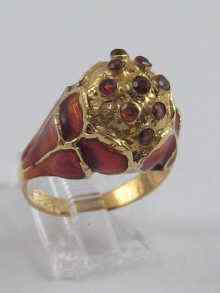 Appraisal: A yellow metal tests ct gold enamel and garnet bombe