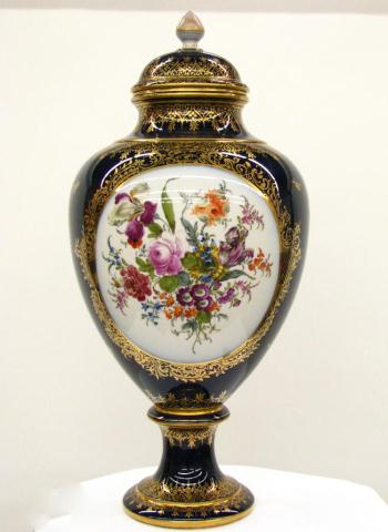 Appraisal: Ornate Dresden porcelain lidded urn cobalt ground inches high ornate