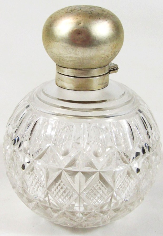 Appraisal: A late Victorian cut glass scent bottle with silver collar